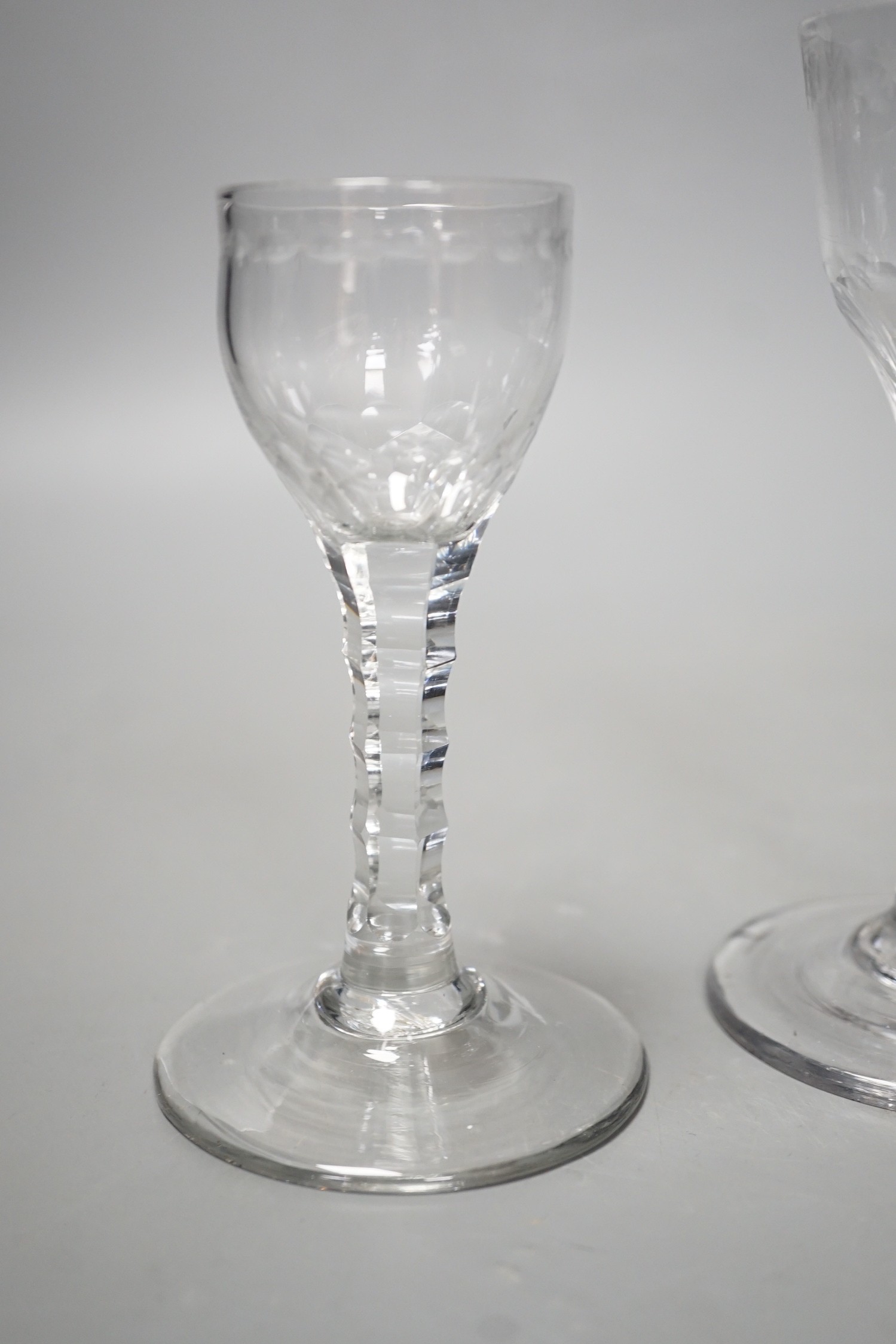 Three George III facet stem ‘OXO’ drinking glasses, tallest 15cms high